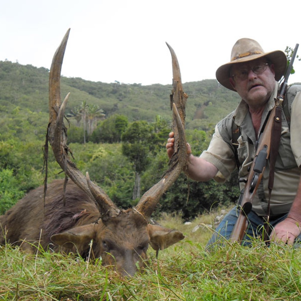 Hunter with Rusa deer trophy